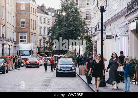 London, UK - August 31, 2019: Cars and people on a street in Covent Garden, London, motion blur, selective focus. Covent Garden is a famous tourist ar Stock Photo