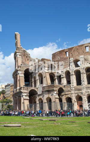 Italy, Rome, Coliseum and queue full of tourists in front of it Stock Photo