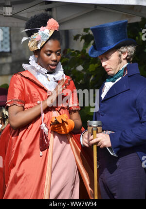 Actors of a period drama filmed by Netflix during breaks Stock Photo