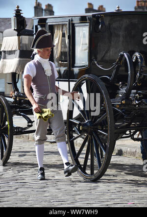 Actors of a period drama filmed by Netflix during breaks Stock Photo