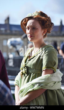 Actors of a period drama filmed by Netflix during breaks Stock Photo