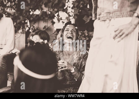 Hippy fashion style trendy group of mixed ages caucasian women using  technology modern phone together - beautiful females with coloured dress  and clot Stock Photo - Alamy