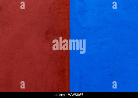 Red and blue concrete wall texture, divided by half Stock Photo