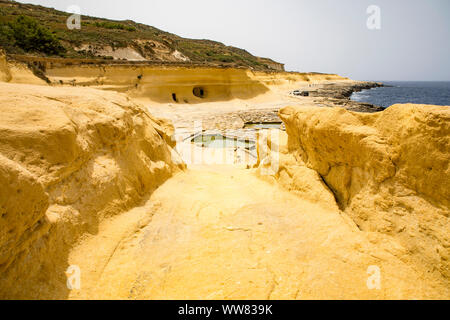 Gozo, neighbouring island of Malta, salt flats, salt pans for sea salt production, in the Xwejni Bay near Marsalforn,