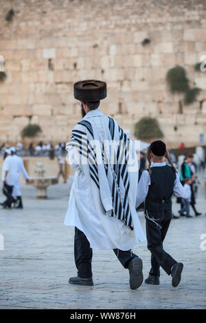 Father and son in traditional Jewish clothes at the Wailing Wall Stock Photo