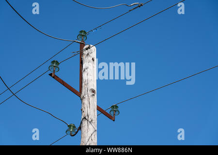 Old wooden electric pole with wires and blue sky Stock Photo - Alamy