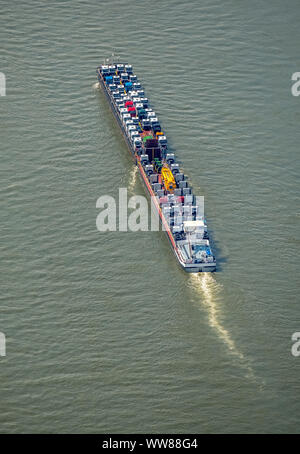 Aerial view, cargo ship on the Rhine going uphill, push boat with additional lighter, tractors and trucks are the freight, inland shipping Duisburg, Ruhrgebiet, North Rhine-Westphalia, Germany