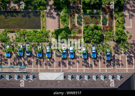 Aerial view, parking lot in front of the police headquarters Oberhausen, blue and green, lined up police cars, police station, Friedensplatz, avenue with young trees, deciduous trees, Oberhausen, Ruhr area, North Rhine-Westphalia, Germany Stock Photo