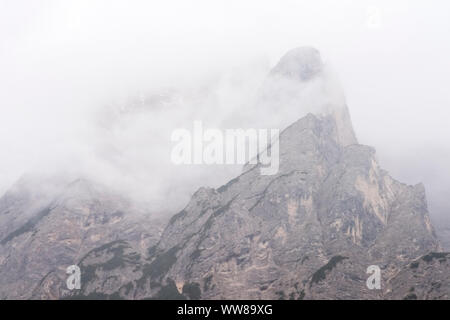 Autumn hike around the Pragser Wildsee in the Dolomites, Italy, Seekofel, cloudy Stock Photo