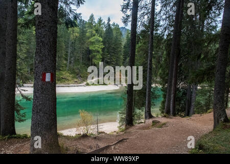 Autumn hike around the Pragser Wildsee in the Dolomites, Italy, hiking trail Stock Photo