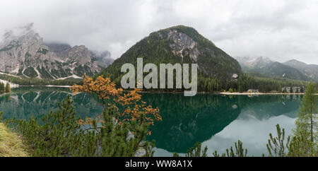 Autumn hike around the Pragser Wildsee in the Dolomites, Italy, panorama composed of 3 pictures Stock Photo