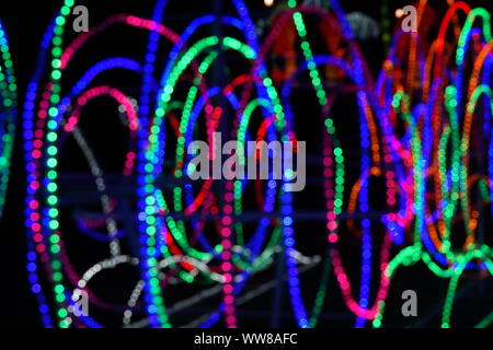 Abstract background of blurred multicolored lines on dark background. Stock Photo