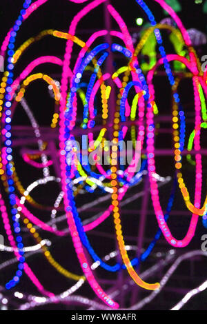 Abstract background of blurred multicolored lines on dark background. Stock Photo