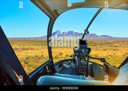 Helicopter cockpit aerial view of Kata Tjuta or The Olgas, domed rock formation in Uluru-Kata Tjuta National park. Tourism in Australian outback Stock Photo