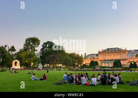 Wien, Vienna, park Stadtpark, palace Kursalon HÃ¼bner, people have a picnic at meadow, 01. Old Town, Wien, Austria Stock Photo