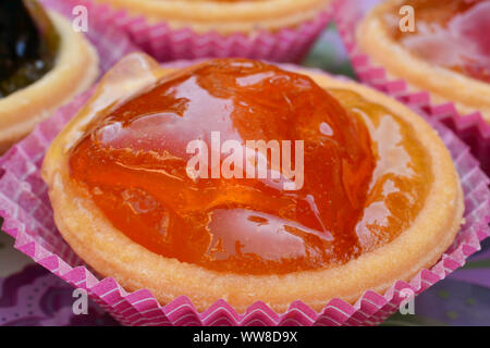 Traditional Greek sweet, candied orange in punnet of dough, close up view Stock Photo