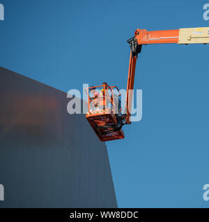 Bergamo Italy 12 September 2019: Workers working on elevating platform while restoring the lighting lamps of the Bergamo stadium Stock Photo