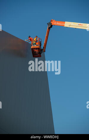 Bergamo Italy 12 September 2019: Workers working on elevating platform while restoring the lighting lamps of the Bergamo stadium Stock Photo