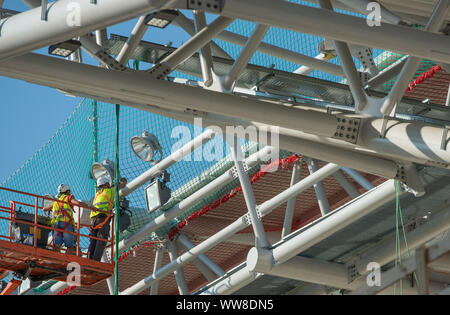 Bergamo Italy 12 September 2019: Workers working on elevating platform while restoring the lighting lamps of the Bergamo stadium Stock Photo