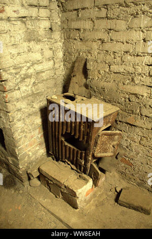 Abandoned iron fire in Auschwitz Birkenau crematorium. Stock Photo