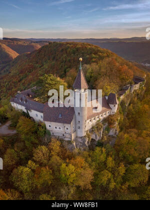 Germany, Owen, aerial view of Teck Castle and autumn forest in the evening Stock Photo