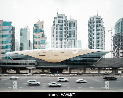 Futuristic building of Dubai metro station and highway in Dubai, United Arab Emirates Stock Photo