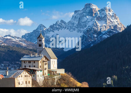 Colle Santa Lucia, the parish church with mount Pelmo in the background, Agordino, Belluno, Veneto, Italy Stock Photo