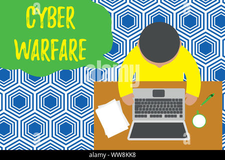 Text sign showing Cyber Warfare. Business photo showcasing Virtual War Hackers System Attacks Digital Thief Stalker Upper view young man sitting worki Stock Photo