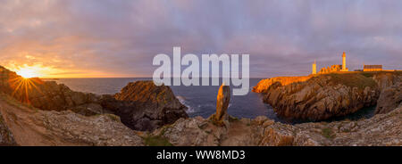 Bay with monolith and lighthouse at sunset, Saint Mathieu lighthouse ...