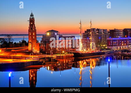 New harbour with sailing ship Mercedes and lighthouse Loschenturm, Bremerhaven, Weser estuary, Land Bremen, Northern Germany, Germany Stock Photo