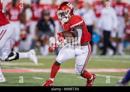 Houston running back Chandler Smith left is attacked by Memphis