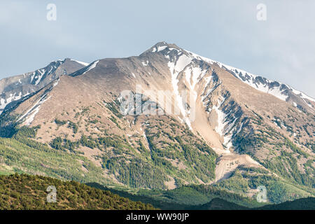 Mt Sopris mountain closeup in Carbondale, Colorado town view with snow mountain peak and sky in summer during sunset Stock Photo