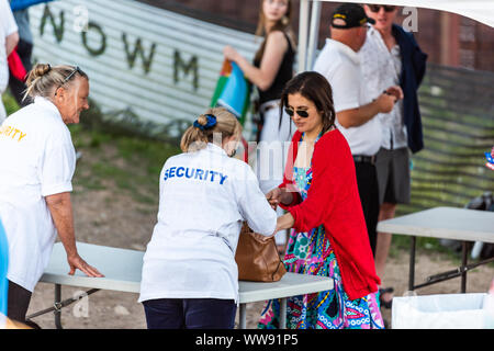 Aspen, USA - July 4, 2019: Snowmass village famous Here Come The Mummies band playing free concert with security checking bags Stock Photo