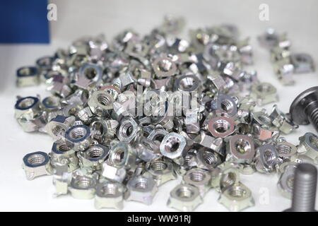 small bolts and nuts by manufacturing process ; tapping Stock Photo