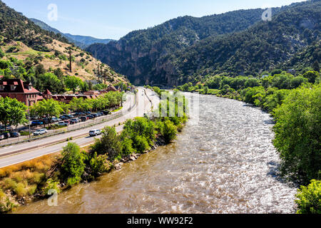 Glenwood Springs, USA - July 10, 2019: Roaring Fork Colorado river in downtown with water and highway in summer Stock Photo