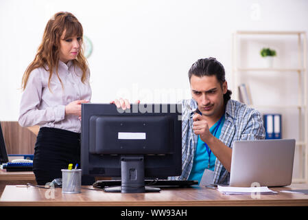 The young male it specialist in the office Stock Photo