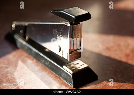 Umea, Sweden - September 5, 2019: stapler in silver and black on marble slab Stock Photo