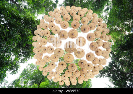 Group of hanging streetlights on a Vietnamese conical hat as seen directly from below Stock Photo
