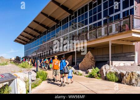 Jensen, USA - July 23, 2019: Exterior Quarry visitor center exhibit hall building in Utah Dinosaur National Monument Park with people tour group walki Stock Photo