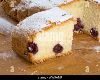 Piece of traditional Hungarian cherry cake on a wooden board Stock Photo