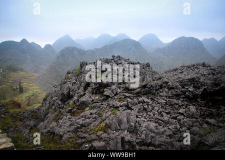 Cinematic landscape scenery of mountains in Dong Van Karst Plateau Geopark in Sa phin, Vietnam Stock Photo