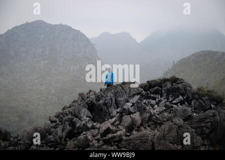 Hiking in Sa phin (site 23) in the Dong Van Karst Plateau Geopark in Ha giang Province, Vietnam Stock Photo