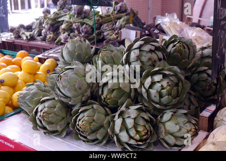 Globe Artichokes (Cynara scolymus) on Display in Forville Market Covered, Cannes, France, EU Stock Photo