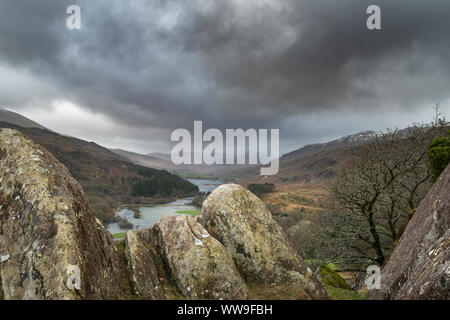 Winter landscape image of the view from Crimpiau and The Pinnacles towards Llynnau Mymbyr and snowcapped Snowdon in the distance Stock Photo