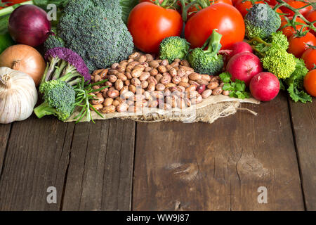 Pinto beans and vegatables on the old wooden table Stock Photo