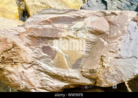 Background of yellow ocher and brown colored natural stone Stock Photo