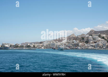 Naxos, Greece - June 28, 2018: Blue water surrounds the town of Naxos, Greece. Stock Photo