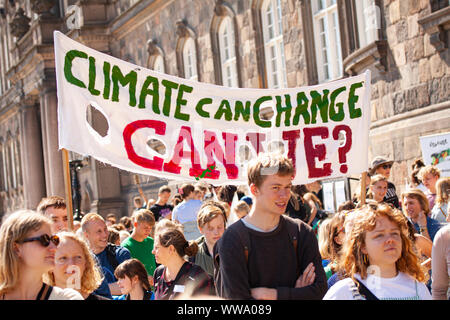 Demonstrators protesting against climate change with banners saying Climate can Change - can we? Stock Photo