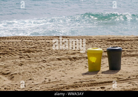 Ocean and trash cans - fighting plastic pollution Stock Photo