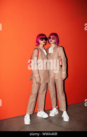 Tokyo twins Ami & Aya on the front row during the Ports 1961 Spring/Summer 2020 London Fashion Week show at the Tate Modern in London. Stock Photo